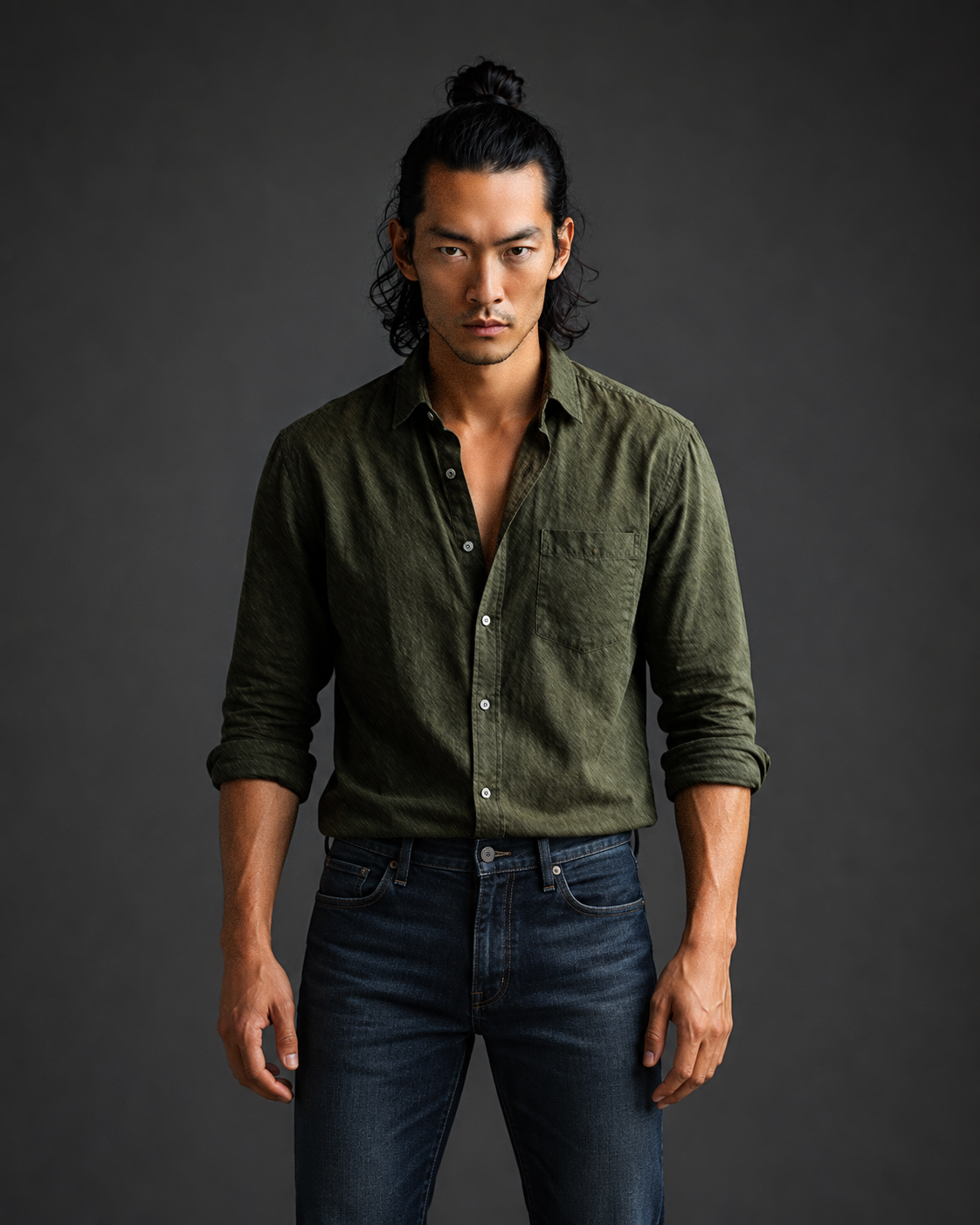 Hiro, male virtual AI fashion model wearing an olive-green shirt and blue jeans, contemporary menswear editorial by VIDA AI